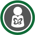 Círculo cinza escuro e contorno verde com a ilustração de uma pessoa com uma borboleta no peito. O ícone representa pessoa com epidermólise bolhosa (EB), porque quem tem EB é conhecido como borboleta